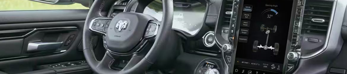 2026 GMC Sierra 1500 steering wheel with GMC emblem and interior controls