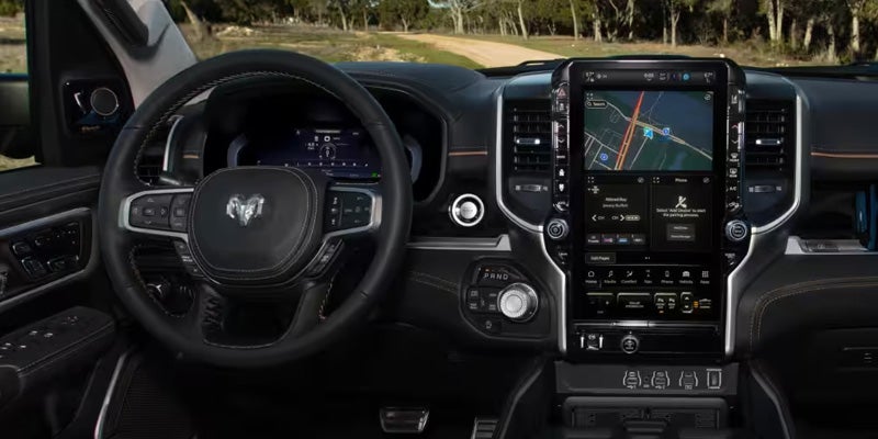 2026 GMC Sierra 1500 steering wheel and GMC infotainment touchscreen system in St. Clairsville OH