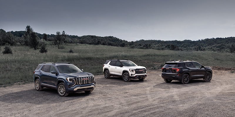 GMC SUV lineup off-road landscape view